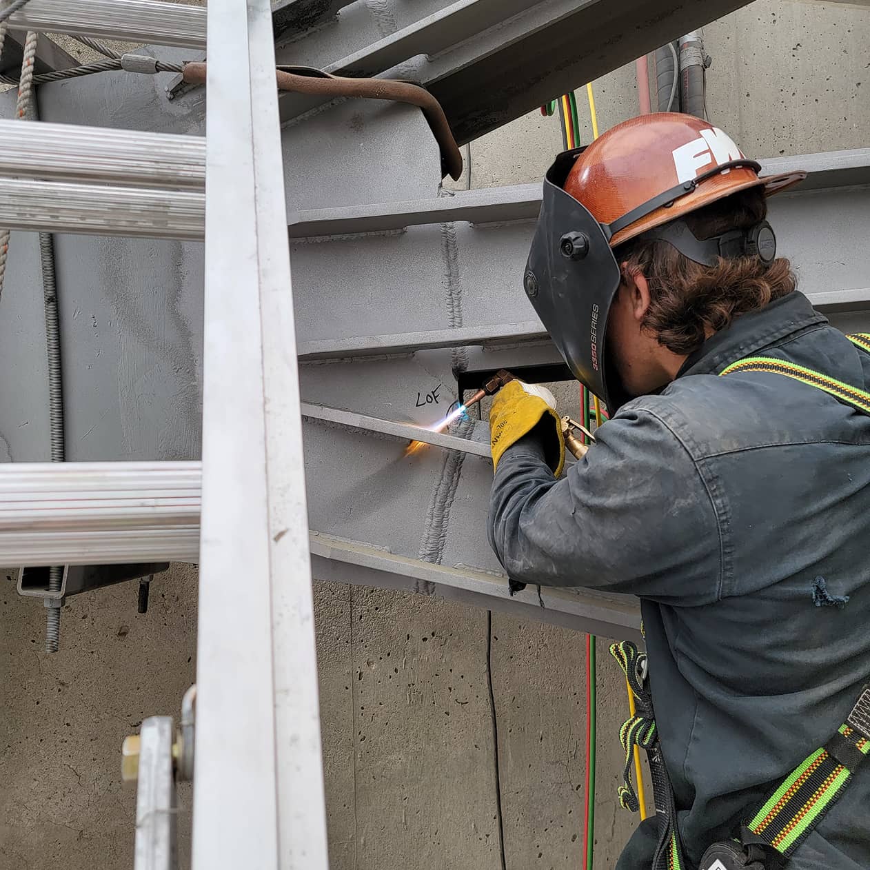 Paragon Construction Services Welder working on Tainter Gate