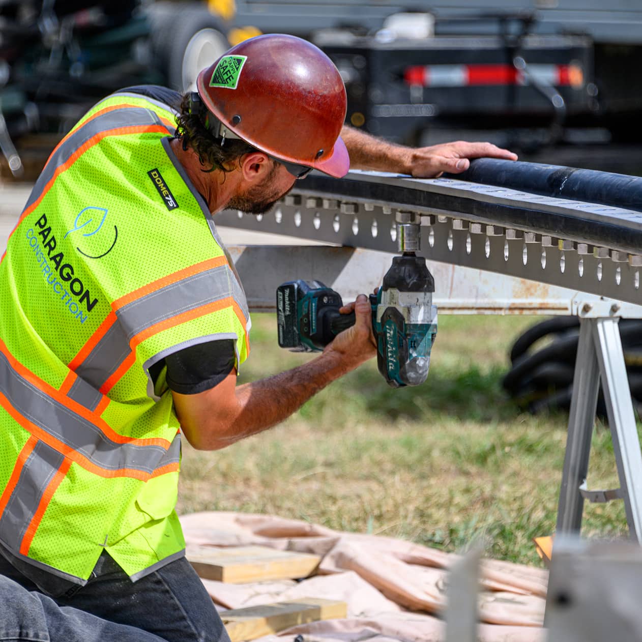 paragon construction services worker with drill